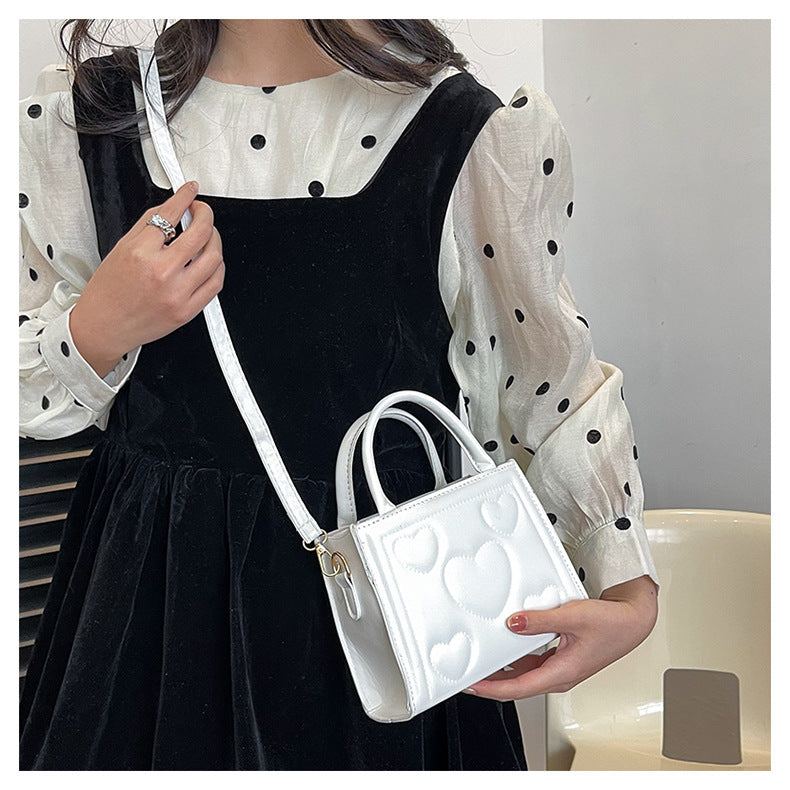 1pc Women’s Stylish Solid Color Handbag with Detachable Strap – Heart Pattern Design, Perfect for Valentine’s Day Gift, Available in Magenta, White, Black, Green, Yellow